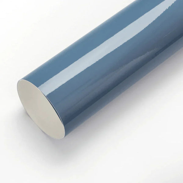 Roll of blue vinyl wrap on a white background
